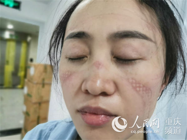 【人民网】医疗队员在一线鏖战 您的家人我们来守护