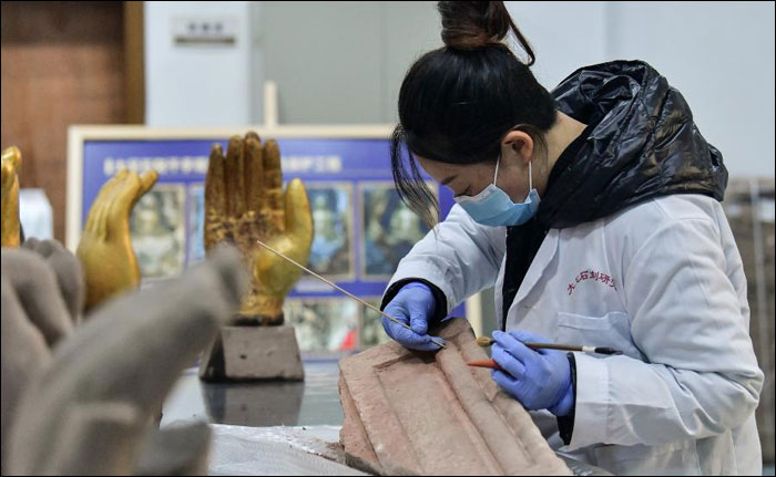 นครฉงชิ่งทุ่มกำลังอนุรักษ์งานพุทธศิลป์หินผาต้าจู๋