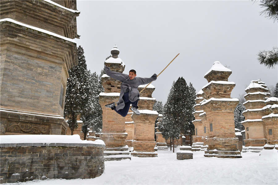 Shaolin monks practise kung fu in the snow