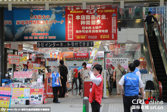 日本商家打中文招牌“喜迎国庆”争夺中国游客