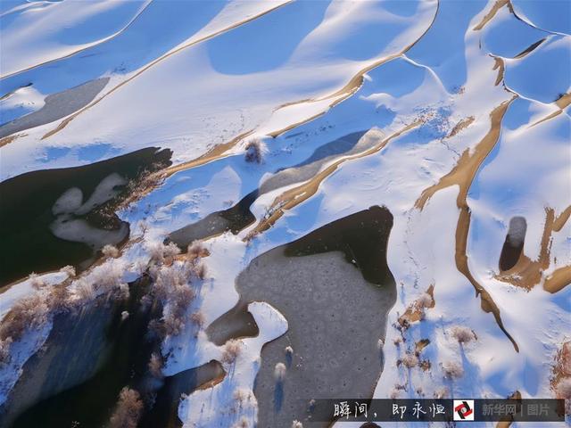 航拍塔克拉玛干沙漠雪景 宛若童话世界