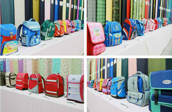 金正恩视察平壤金正淑纺织厂 赞国产书包喜笑颜开