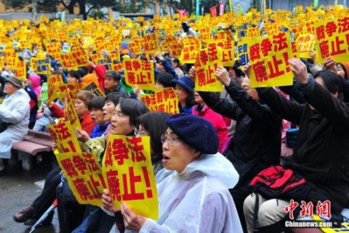 日本新安保法抗議聲中上馬 安倍強推"黷武"意願