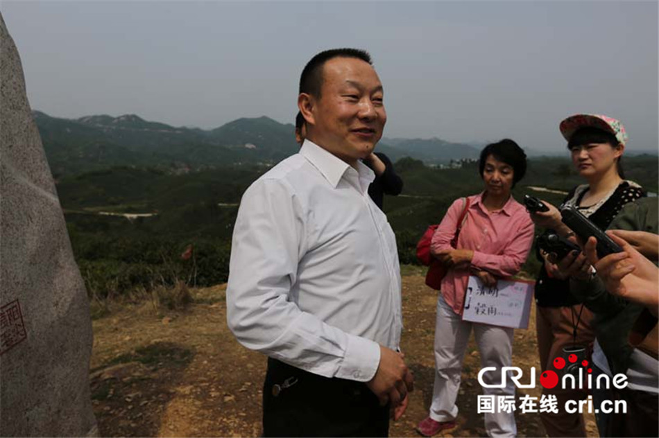cri中外记者信阳行:茶,绿了信阳山,扬了信阳名,富了信阳人