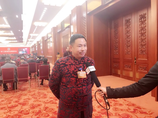 蒋佳明在北京人民大会堂参加管理者年会接受央视采访