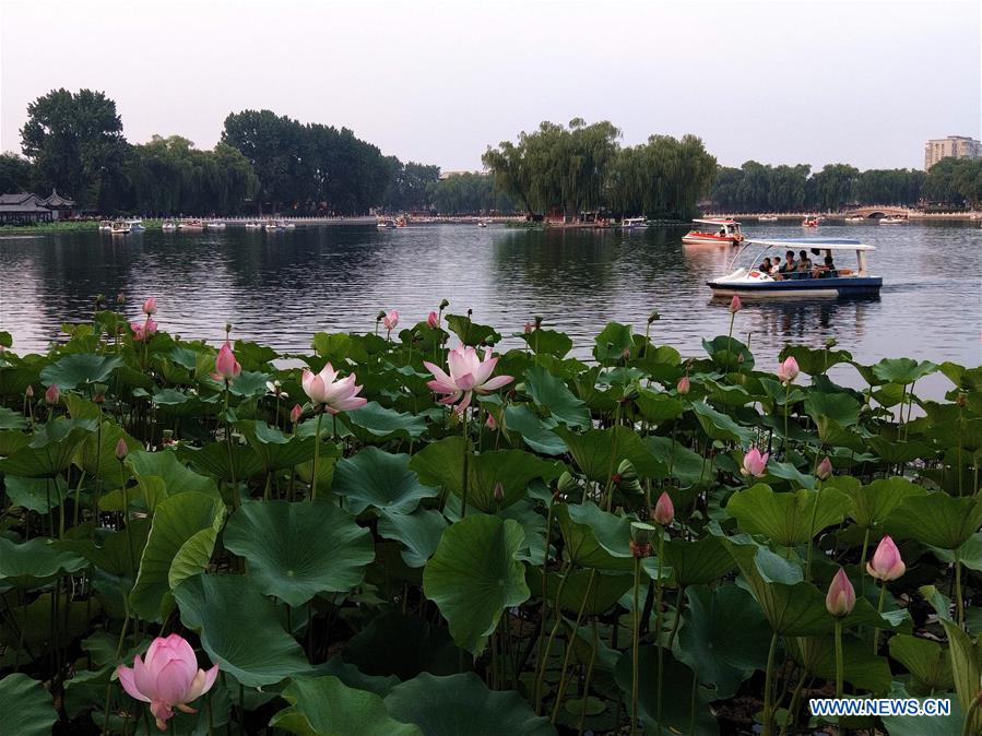 People go sightseeing at Shichahai scenic area in Beijing