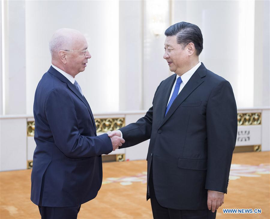 Xi meets Schwab, vows greater opening up