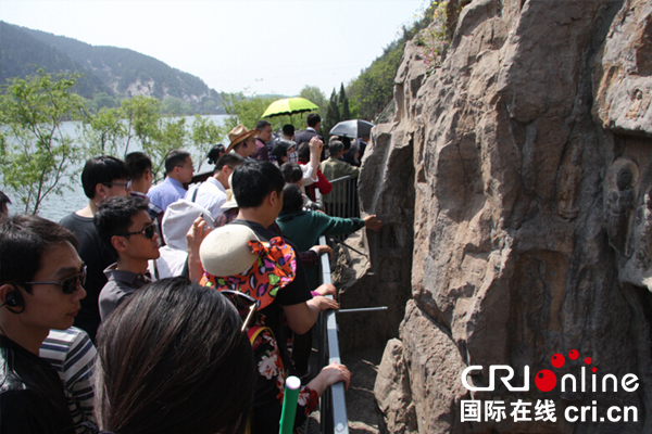 【多语种报道】朝鲜语记者李昌男：龙门石窟体现中国人的爱国情节