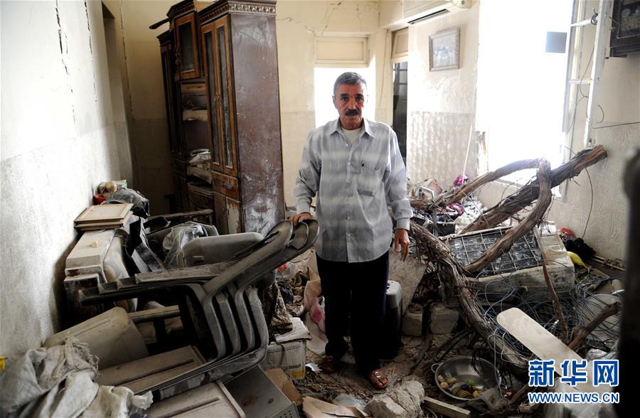 记者手记：艰难困顿　生生不息——记危楼中顽强生活的阿勒颇居民